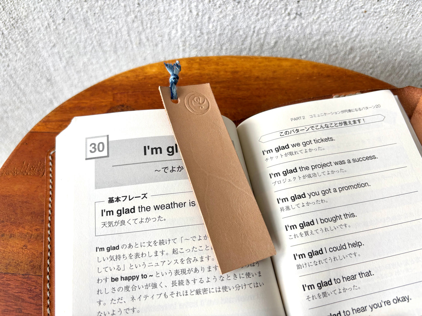 Leather bookmark tied with indigo-dyed thread